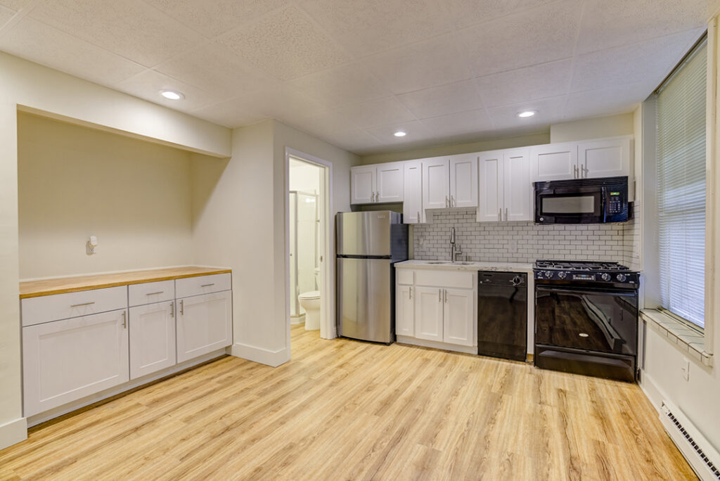 Empty interior and kitchen in Mark Hopkins apartment