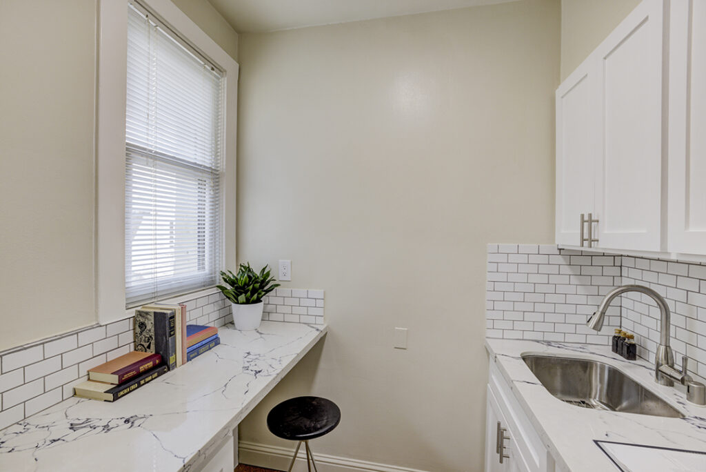 Kitchen with white counter tops at Mark Hopkins