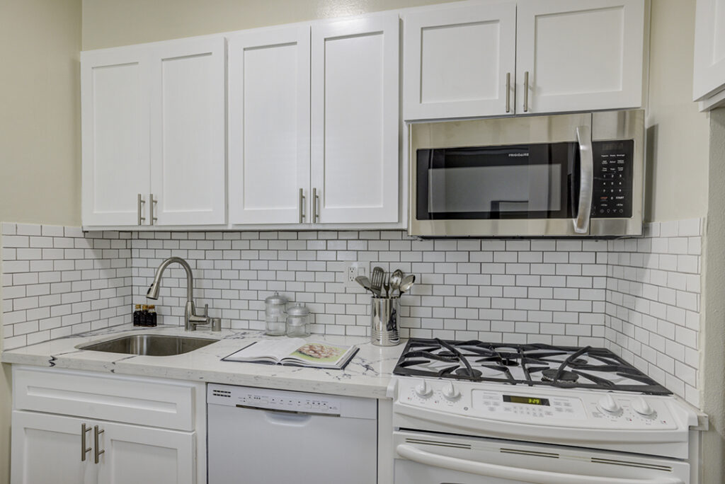 Kitchen interior with white cabinetry at Mark Hopkins