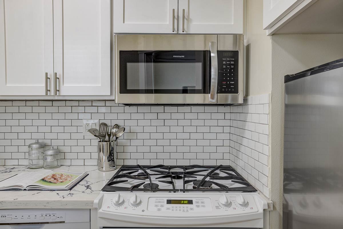 Mark Hopkins Condominiums staged apartment kitchen oven